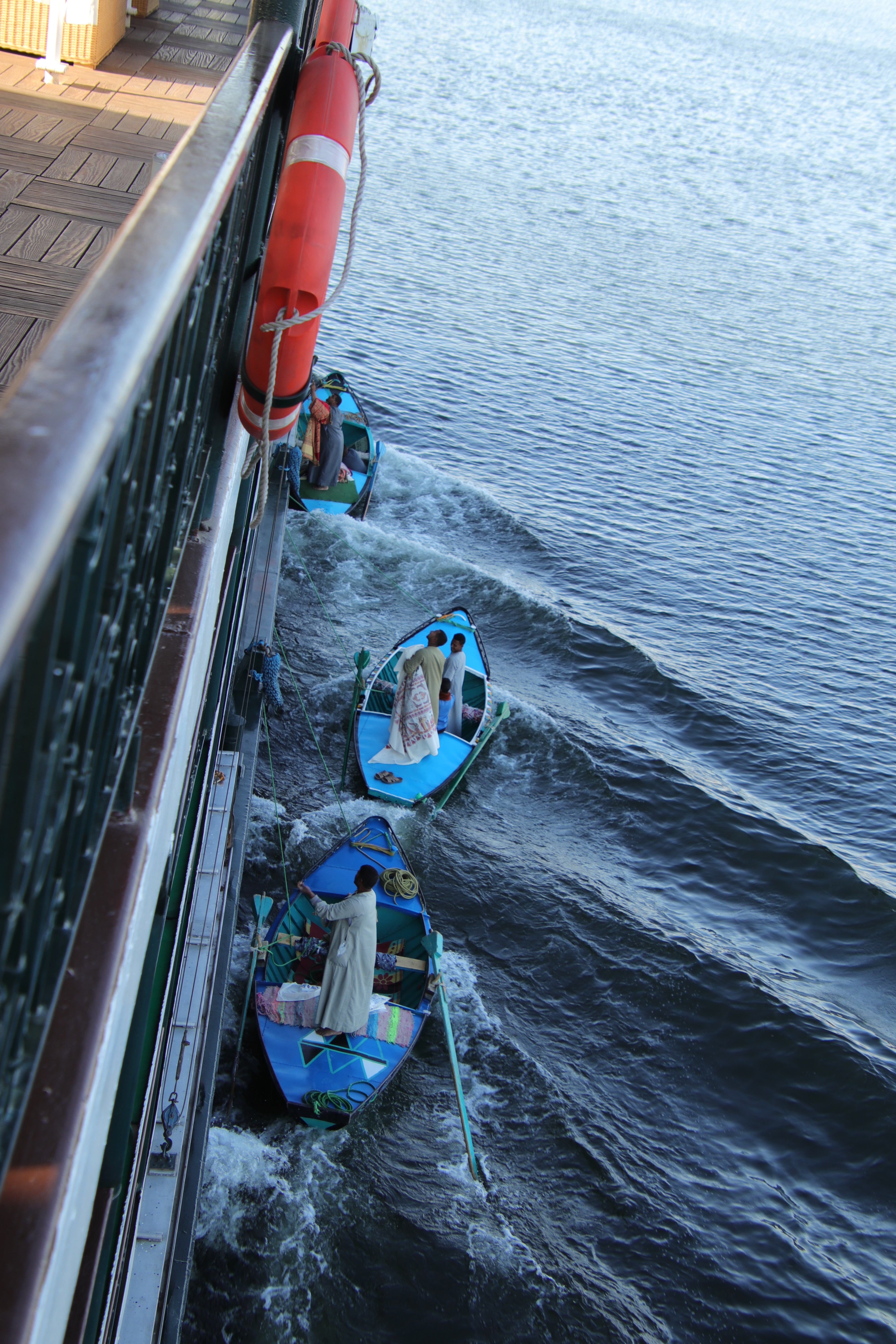 Merchants in rowboats