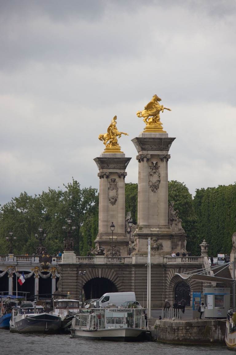 Golden statues on The Concorde Bridge