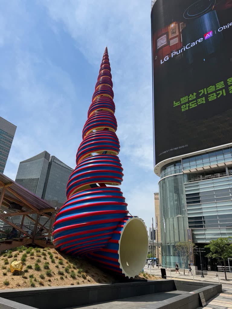 Sculpture and large screen