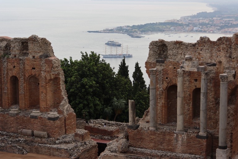 Ships in the bay through the theater